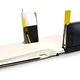 Illustration for article titled A Tiny iPhone Photography Studio Built Into a Moleskine Notebook
